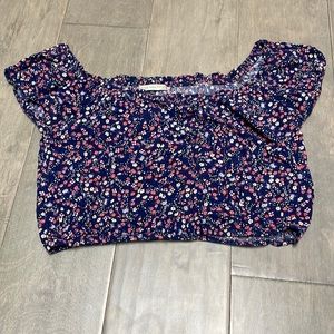Blue, flowery, off the shoulder, crop top, size medium for girls.